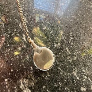 Silver necklace with liquid metal pendant